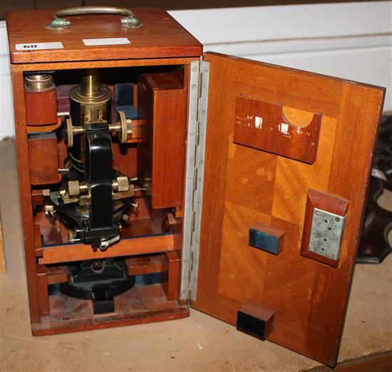Mahogany cased Zeiss microscope with fitted containers for lenses, etc